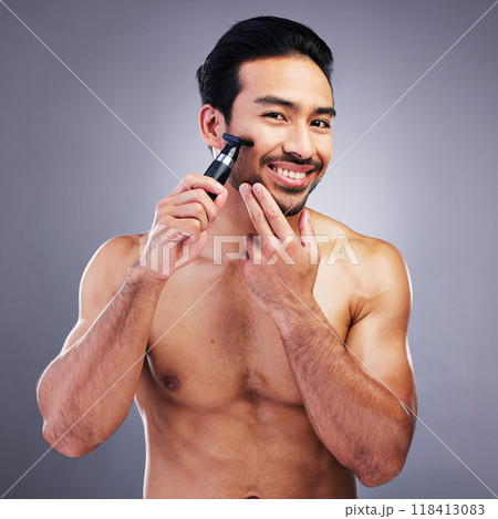 Beard hair trimmer, portrait or happy man with bathroom routine, grooming or morning smile for shaving skincare. Face cleaning, facial growth maintenance or studio person happiness on gray background 118413083