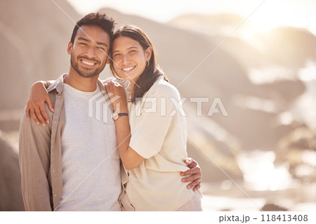 Portrait, couple and holiday with hug at ocean with happiness in the summer on the weekend. Face, smile and man with woman at the beach for travel with the sunshine for bond together on a trip. Portrait, couple and holiday with hug at ocean with happiness in the summer on the weekend. Face, smile and man with woman at the beach for travel with the sunshine for bond together on a trip. 118413408