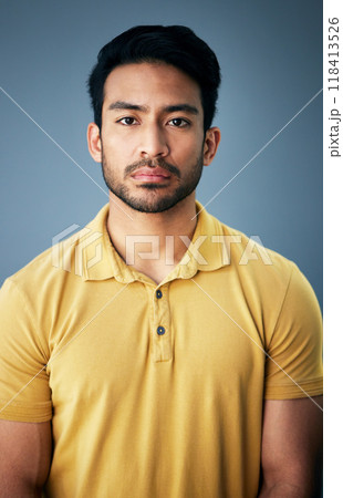 Confidence, serious and portrait of a man in studio with depression, sadness or mental health problem. Tired, exhausted and Indian male model with burnout face expression isolated by gray background. 118413526