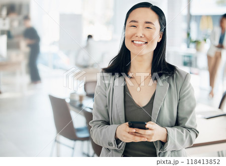 Portrait, success and Asian woman in office, smartphone and typing for social media, happiness and connection. Face, Japanese female employee and manager in workplace, cellphone and communication 118413852