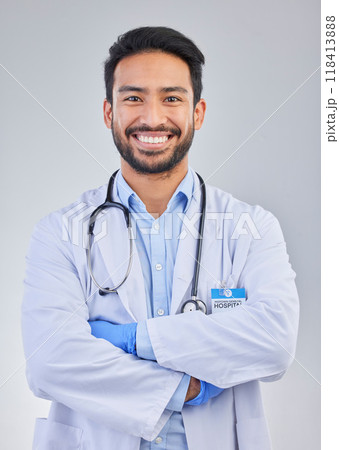 Doctor, happy man and portrait in a studio with a smile from success, motivation and stethoscope. Happiness, medical consultant and hospital worker with gray background smiling about health vision Doctor, happy man and portrait in a studio with a smile from success, motivation and stethoscope. Happiness, medical consultant and hospital worker with gray background smiling about health vision 118413888