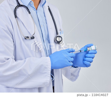 Injection, doctor hands and vaccine vial in studio for safety, healthcare and pharmaceutical medicine. Closeup, vaccination and liquid bottle for virus risk, immunity and medical antibiotics drugs Injection, doctor hands and vaccine vial in studio for safety, healthcare and pharmaceutical medicine. Closeup, vaccination and liquid bottle for virus risk, immunity and medical antibiotics drugs 118414027