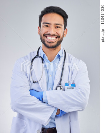 Doctor, man and portrait in a studio with a smile from success, motivation and stethoscope. Happiness, medical consultant and hospital worker with white background smiling about health and wellness Doctor, man and portrait in a studio with a smile from success, motivation and stethoscope. Happiness, medical consultant and hospital worker with white background smiling about health and wellness 118414036
