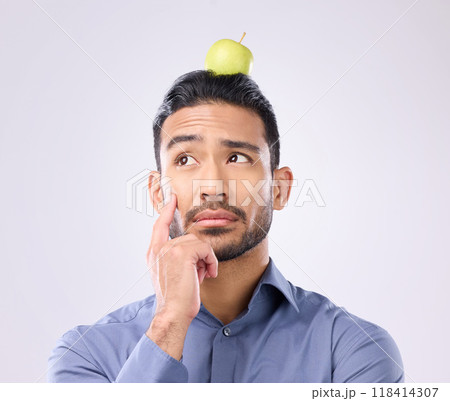 Apple, head balance and man thinking of fruit product choice for weight loss diet, healthcare food or detox. Nutritionist face, studio person and contemplating male vegan isolated on gray background 118414307