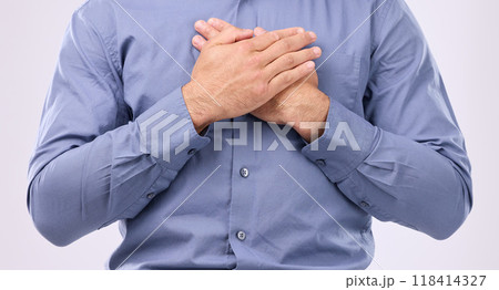 Closeup, hands on chest and man in studio with self love, hope and love on grey background space. Zoom, hand and open heart gesture by male show emoji, gratitude and calm zen while standing isolated 118414327