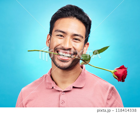 Teeth, flower and rose with portrait of man in studio for celebration, gift and romance. Funny, goofy and present with male isolated on blue background for happiness, smile and valentines day mockup Teeth, flower and rose with portrait of man in studio for celebration, gift and romance. Funny, goofy and present with male isolated on blue background for happiness, smile and valentines day mockup 118414338
