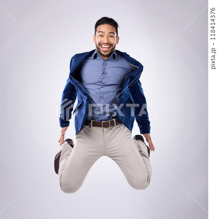 Jump, excited and portrait of man in studio with surprise, happiness and celebration on white background. Winner, success mockup and isolated happy male jumping with energy for winning, smile and joy 118414376
