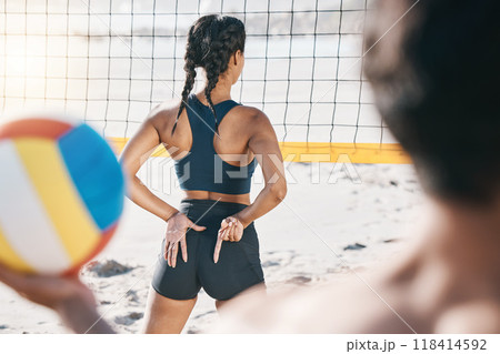 Woman, beach and exercise with volleyball and hand sign for communication or block signal. Behind young person or athlete ready for sport, fitness or fun game outdoor in nature or sand with a partner 118414592