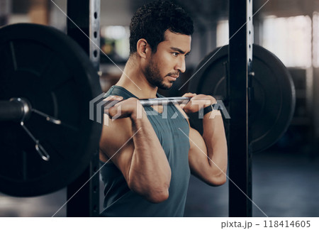 Exercise, workout and man with barbell in gym for fitness, strong muscle power or health. Bodybuilder, training and male athlete weightlifting for wellness, sports and serious focus on shoulder press 118414605