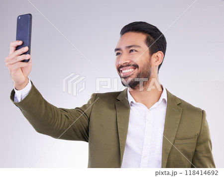 Businessman, face and selfie with smile for profile picture, vlog or social media against a white studio background. Happy isolated employee man smiling on smartphone for photo, memory or online post 118414692