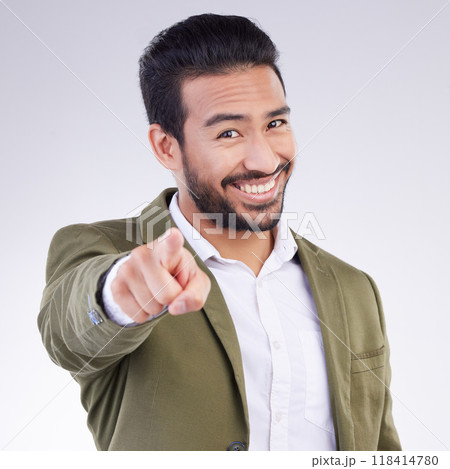 Portrait, success and Asian man pointing to you, happiness and cheerful against a grey studio background. Face, Japanese male employee and guy with gesture for space or finger show choice or decision 118414780