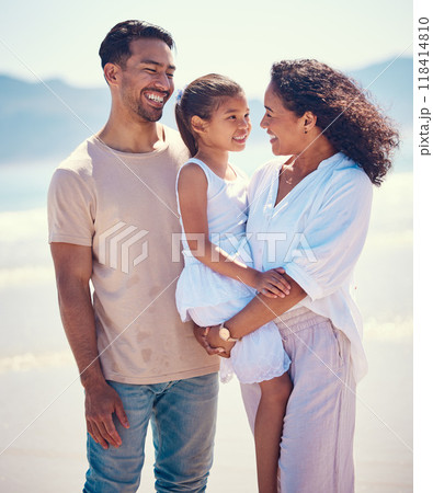 Happy family, beach and hug of a mother, father and girl together by the ocean. Nature, sea and love of a mom, dad and child from the Philippines on a vacation with parents on travel holiday 118414810