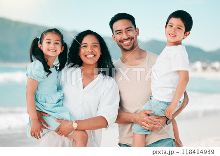 Family in portrait on beach, parents and children with bonding on holiday, happy people and smile with travel. Mother, father and young kids, tropical vacation in Mexico with love and care outdoor Family in portrait on beach, parents and children with bonding on holiday, happy people and smile with travel. Mother, father and young kids, tropical vacation in Mexico with love and care outdoor 118414939