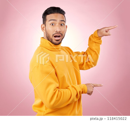 Surprise, pointing and wow with portrait of man in studio for show, announcement and deal. News, advertising and idea with person on pink background for promotion, information and solution mockup Surprise, pointing and wow with portrait of man in studio for show, announcement and deal. News, advertising and idea with person on pink background for promotion, information and solution mockup 118415022