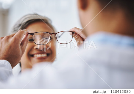 Vision, optometry and woman with glasses, smile or prescription lenses with eye care. Female client, customer or optometrist helping lady, eyewear or clear eyesight in office and new frame spectacles 118415080