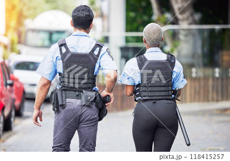 Police, people or walking in city for safety, law enforcement and urban patrol from the back. Man, woman and team of public service cops, metro security guard or protection in street together outdoor 118415257