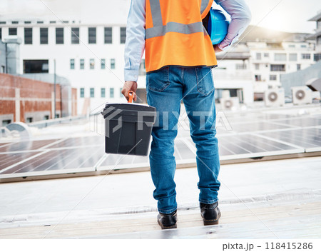 Tool box, construction worker and back with solar panel maintenance and labor outdoor. Roof, eco engineer and green energy project with builder and sustainability contractor with building project 118415286