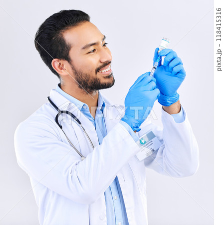 Doctor with smile, syringe and vaccine in studio for healthcare, medicine and innovation in medical science. Vaccination, booster shot in bottle and needle, health care and help with virus protection Doctor with smile, syringe and vaccine in studio for healthcare, medicine and innovation in medical science. Vaccination, booster shot in bottle and needle, health care and help with virus protection 118415316