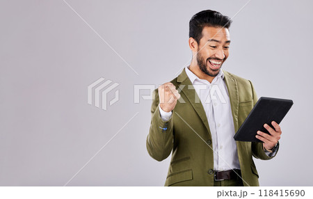 Businessman, tablet or success fist on isolated studio background for financial growth, stock market deal or mock up security. Smile, happy or cheering asian man with winner hands, technology or loan 118415690