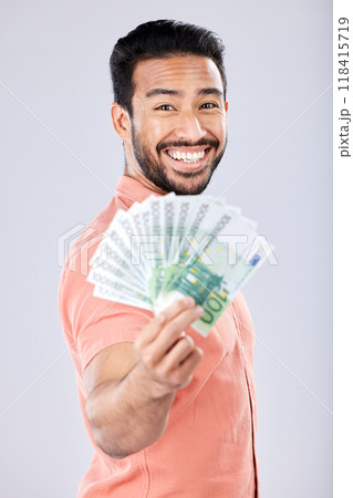 Showing, rich and portrait of Asian man with money isolated on a grey studio background. Finance, wealth and excited person holding cash from investment, lottery and winning the jackpot on a backdrop 118415719