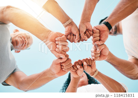 Fist bump, hands and business people with support on sky background for teamwork, solidarity or low angle commitment. V, sign and team power sign in collaboration, partnership or goal motivation Fist bump, hands and business people with support on sky background for teamwork, solidarity or low angle commitment. V, sign and team power sign in collaboration, partnership or goal motivation 118415831