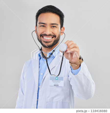 Doctor, man and listen with stethoscope in portrait with smile and cardiovascular health isolated on white background. Medical professional, happy male physician in studio and cardiology and surgeon 118416080