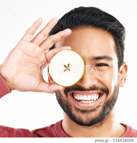 Apple, fruit and portrait of man with smile on white background for diet, nutrition and detox. Healthy body, food and isolated face of happy male with slice for breakfast, snack and lunch in studio 118416099