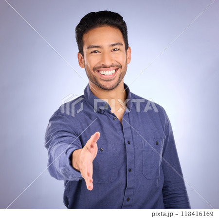 Hand shake, welcome and portrait of a business man with happiness from deal agreement. Isolated, blue background and studio with a young man ready for shaking hands for onboarding or yes hand sign 118416169