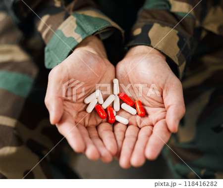 Soldier, hands and drugs from psychologist in therapy or person healing mental health with medication, medicine or pills. Stress, anxiety and veteran in therapy with trauma, problem or depression 118416282