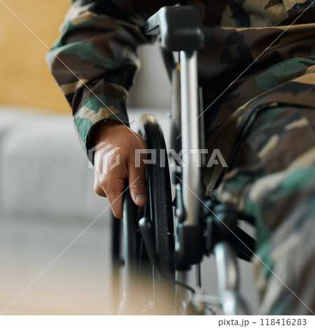 Man, hands and wheelchair in army from accident, war injury or healthcare support at hospital. Closeup of soldier or person with a disability holding wheel in commitment for recovery or physiotherapy Man, hands and wheelchair in army from accident, war injury or healthcare support at hospital. Closeup of soldier or person with a disability holding wheel in commitment for recovery or physiotherapy 118416283