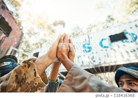 Paintball, hands and high five for teamwork, support or trust in game plan, collaboration or unity on battle field. Group of paintballers touching hand for team building motivation before match start Paintball, hands and high five for teamwork, support or trust in game plan, collaboration or unity on battle field. Group of paintballers touching hand for team building motivation before match start 118416368