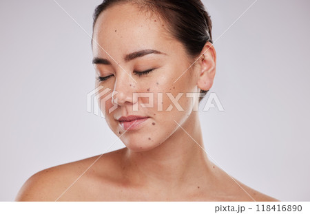 Skincare, face and beauty of a woman in studio for cosmetic, dermatology and makeup shine. Aesthetic asian model person with wellness glow, mole on skin and luxury facial self care on grey background Skincare, face and beauty of a woman in studio for cosmetic, dermatology and makeup shine. Aesthetic asian model person with wellness glow, mole on skin and luxury facial self care on grey background 118416890