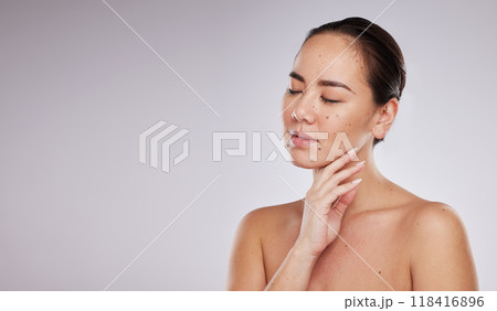 Skincare, hand on face and woman with mockup space in studio for beauty, dermatology and cosmetics. Aesthetic asian model with makeup, skin glow and luxury self care facial results on grey background Skincare, hand on face and woman with mockup space in studio for beauty, dermatology and cosmetics. Aesthetic asian model with makeup, skin glow and luxury self care facial results on grey background 118416896