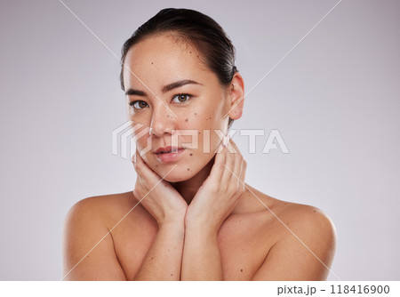 Beauty, face and portrait of a woman in studio for skincare, dermatology and cosmetic for skin glow. Aesthetic asian model person with makeup shine and luxury self care facial grey background Beauty, face and portrait of a woman in studio for skincare, dermatology and cosmetic for skin glow. Aesthetic asian model person with makeup shine and luxury self care facial grey background 118416900