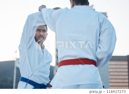 Karate, fight and men in city for exercise, workout and training outdoor. Martial arts, sports and people in competition for taekwondo, serious battle or combat challenge for healthy body in fitness Karate, fight and men in city for exercise, workout and training outdoor. Martial arts, sports and people in competition for taekwondo, serious battle or combat challenge for healthy body in fitness 118417273