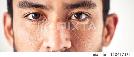 Closeup, portrait and man with eyes, vision and looking forward with sight, see and clear optics. Face, male person or model with eyesight, zoom or eyecare with health, wellness or staring with focus 118417321