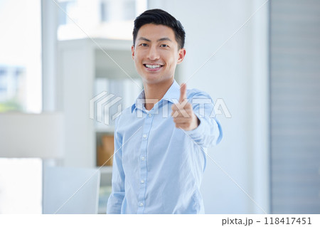 Thumbs up, portrait and happy business man in office with winning, sign or thank you gesture. Face, smile and asian male entrepreneur with hand emoji or vote for yes, like and satisfaction or approve Thumbs up, portrait and happy business man in office with winning, sign or thank you gesture. Face, smile and asian male entrepreneur with hand emoji or vote for yes, like and satisfaction or approve 118417451