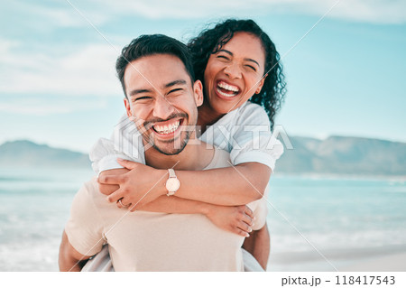 Love, portrait and piggyback with couple on beach for travel, summer and vacation together. Peace, smile and relax with man and woman hugging on date for seaside holiday, care and mockup space 118417543
