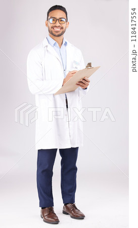 Portrait, asian man and doctor in studio with clipboard, documents or healthcare administration. Happy medical worker writing report of insurance checklist, test results or script on white background 118417554
