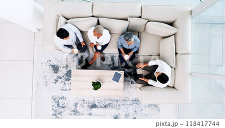 Business people, meeting and relax in lounge at office for lunch break, collaboration or team building above. Top view of employees in social discussion or collaboration on sofa together at workplace Business people, meeting and relax in lounge at office for lunch break, collaboration or team building above. Top view of employees in social discussion or collaboration on sofa together at workplace 118417744