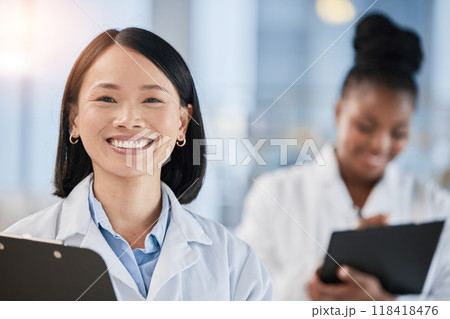 Asian doctor woman, checklist and portrait with smile, planning or happy at clinic with african expert. Medic, teamwork and clipboard for schedule, analysis or results in hospital for healthcare goal 118418476