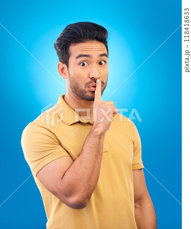 Man, studio portrait and secret with finger on lips for silence, quiet and stop noise by blue background. Young asian guy, student and icon to cover mouth for deal, confidential and privacy emoji Man, studio portrait and secret with finger on lips for silence, quiet and stop noise by blue background. Young asian guy, student and icon to cover mouth for deal, confidential and privacy emoji 118418633