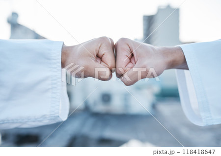 Motivation, support and fist bump for karate in the city for fitness, training or learning. Deal, goal and together hands of people in creative sports or martial arts with power and urban competition 118418647
