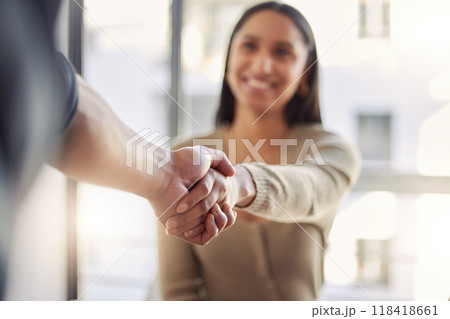 Handshake, partnership and agreement with a business woman and colleague in an office for a meeting. Thank you, collaboration and trust with people shaking hands together in a corporate workplace 118418661