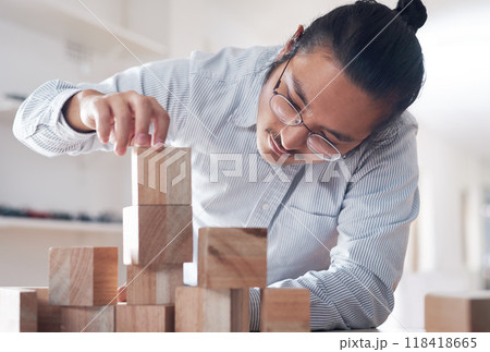 Building block, business and man with plan, vision challenge game and design innovation for balance at a startup. Engineering, architecture and designer with wood blocks for problem solving ideas. 118418665