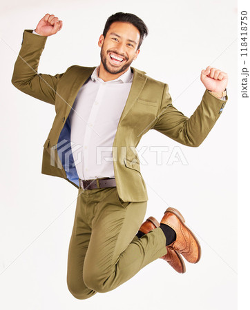 Winner, business man and jump for success, celebration and yes in stock market and bonus on white background. Wow, excited portrait and corporate asian person for financial goals in air and studio 118418750