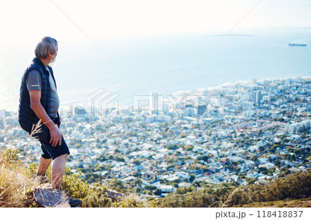 Hiking, explore and senior man with city view for on an adventure, workout and fitness in Cape Town. Training, exercise and elderly person trekking on a mountain for health and wellness Hiking, explore and senior man with city view for on an adventure, workout and fitness in Cape Town. Training, exercise and elderly person trekking on a mountain for health and wellness 118418837