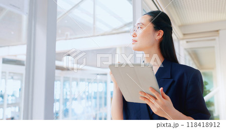 Asian business woman, tablet and thinking in office for planning online report, research information and app. Worker, ideas and scroll on digital technology, social network and update data on website Asian business woman, tablet and thinking in office for planning online report, research information and app. Worker, ideas and scroll on digital technology, social network and update data on website 118418912