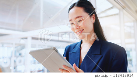 Asian business woman, tablet and smile in office for planning online report, search information and app. Happy corporate worker scroll on digital technology, social network and update data on website Asian business woman, tablet and smile in office for planning online report, search information and app. Happy corporate worker scroll on digital technology, social network and update data on website 118418914