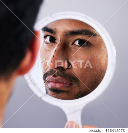 Plastic surgery, mirror and drawing with facial of man and lines for rhinoplasty and nose. Skincare, face and dermatology of a male person with medical filler procedure and reflection in studio Plastic surgery, mirror and drawing with facial of man and lines for rhinoplasty and nose. Skincare, face and dermatology of a male person with medical filler procedure and reflection in studio 118418978
